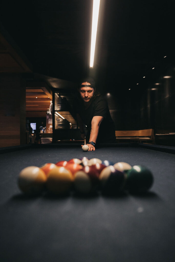 A man getting ready to play pool